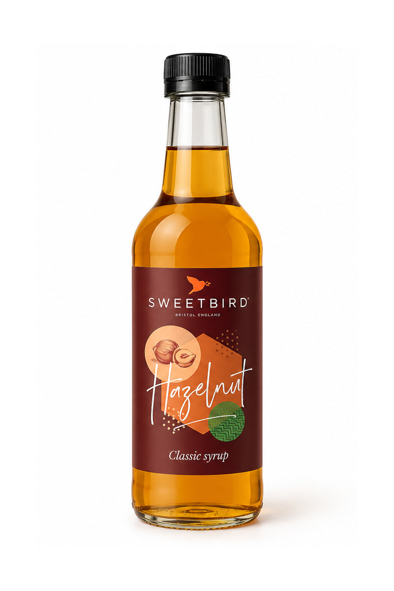 Sweetbird Hazelnut Syrup 250ml glass bottle with black cap on a clean white background.